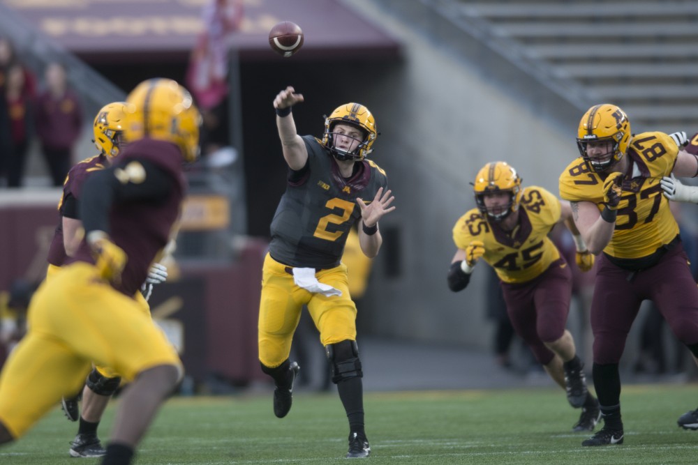 Quarterback Tanner Morgan throws the ball during the Gophers football spring game at TCF Bank Stadium on Thursday, April 12.