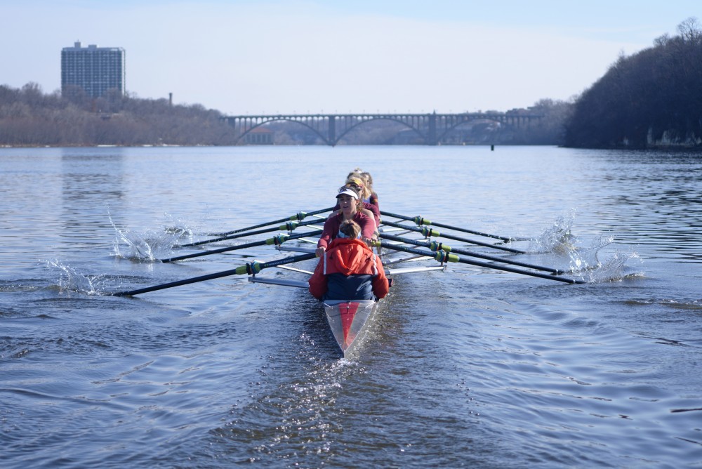 The University of Minnesota rowing team practices on Tuesday, March 27 on the Mississippi River.