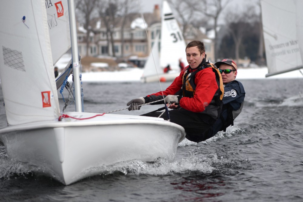 Matt Granstrom left, and Ryan Sigurdson practice starting drills with three other sail boats during practice on Wayzata Bay on Tuesday, April 10.