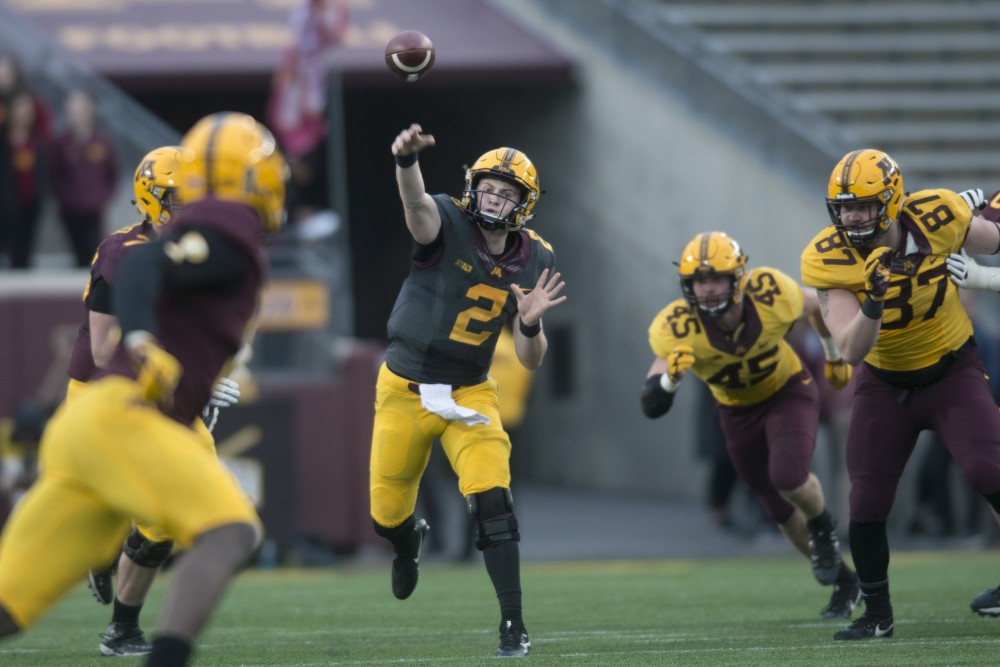 Quarterback Tanner Morgan throws the ball during the Gopher Football Spring Game at TCF Bank Stadium on Thursday, April 12.