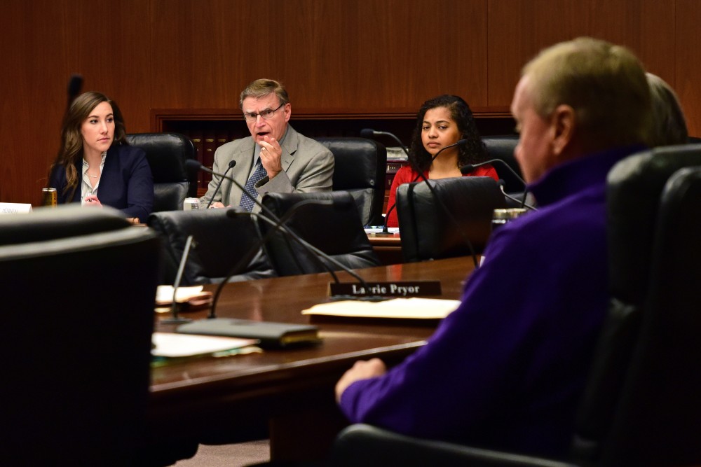Minnesota House of Representatives Committee on Higher Education Chair Bud Nornes speaks to Rep. Gene Pelowski during the committees hearing on the Universitys Board of Regents selection process at the Minnesota State Office Building on Feb. 28, 2018.