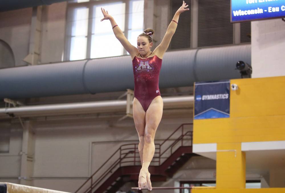 Lexy Ramler competes on the balance beam at the regional NCAA gymnastics championship on Saturday, April 7, 2018.