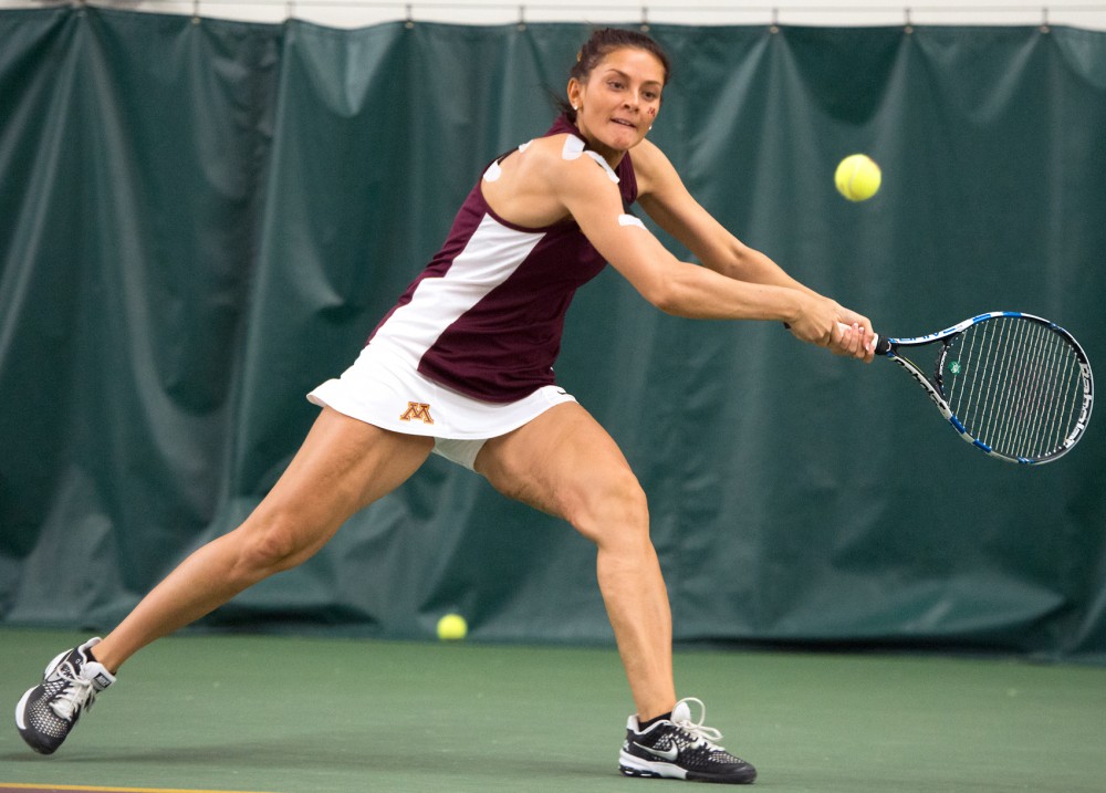 Julia Courter plays for the Gophers during a game in 2016. Courter now coaches tennis at Hamline University.