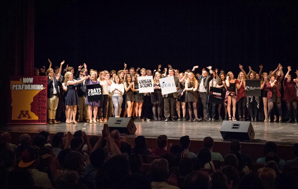 University of Minnesota a cappella groups stand on stage as the winner of Battle for the Vox is announced.
