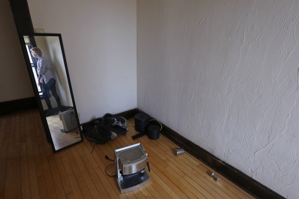 Computer science major Jeremiah Michalik poses for a portrait in his empty apartment on Tuesday, April 24 in Minneapolis. Michalik struggles to pay his $500 monthly rent, so hes adding a commute to school and moving to Crystal, Minnesota to cut costs.