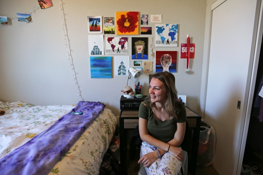 Global studies major Samantha Truesdell poses for a portrait in her apartment at the Radius on Tuesday, April 24 in Minneapolis. Truesdell is a first generation college student who pays her own way, earning scholarships, grants and working as a nanny to get by financially.