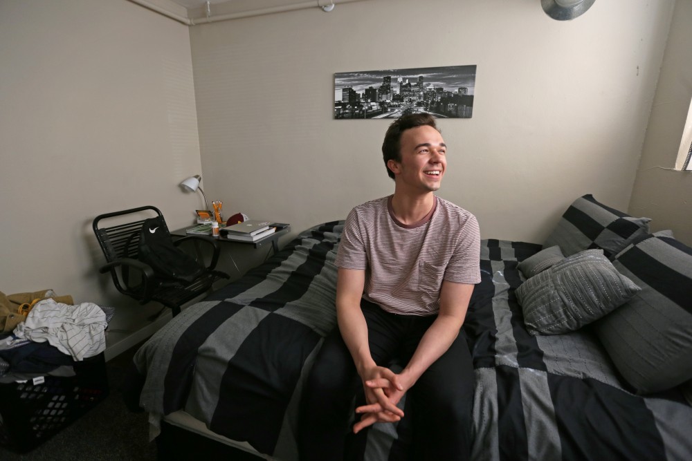 Economics sophomore Chasse Thomas poses for a portrait in his Dinkytown apartment on Tuesday, April 24 in Minneapolis. Thomas works at Gopher Digital Productions to earn cash to pay for school, and is skipping his gap year in between law school because he cant start paying off his federal loans without a full time job.