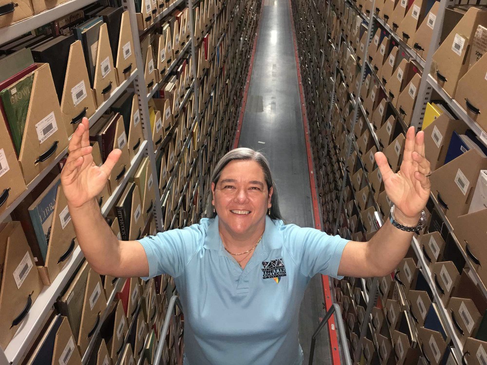 Curator of the Tretter Collection Lisa Vecoli poses for a portrait in the University archives. 