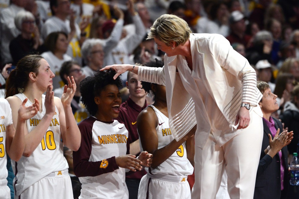 Head Coach Marlene Stollings ruffles Kenisha Bells hair in celebration of a Gophers win against Maryland at Williams Arena on Sunday, Feb. 18, 2018. 