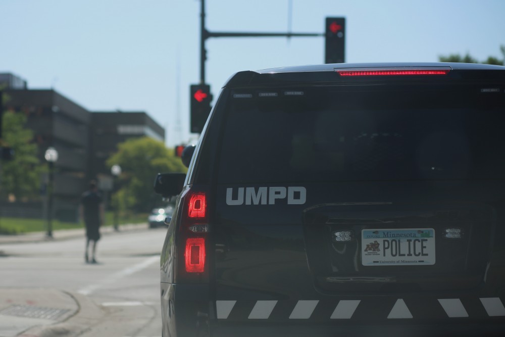 A police car patrols University Avenue near TCF Bank Stadium on Tuesday, May 29, 2018.
