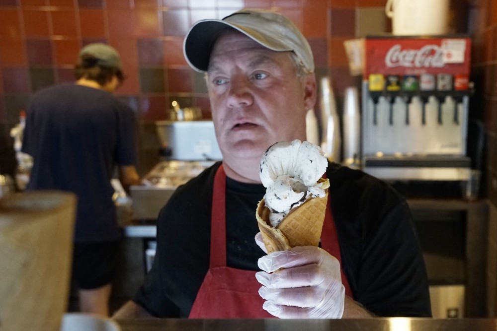 Greg Galles shows off Grand Ole Creamerys signature ice cream flavor, Black Hills Gold, on Saturday, May 26, 2018. The flavor is made up of Oreo cookies with pralines and pecans in a caramel-based ice cream.