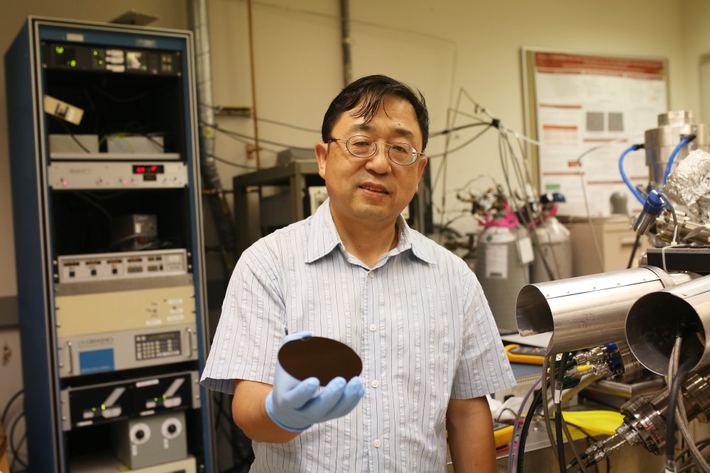 C-SPIN Director Jiang-Ping Wang stands in front of a homemade, modified manufacture semiconductor device system in Keller Hall on Thursday, May 31. The machine completes the action that its name describes—manufactures semiconductor devices.