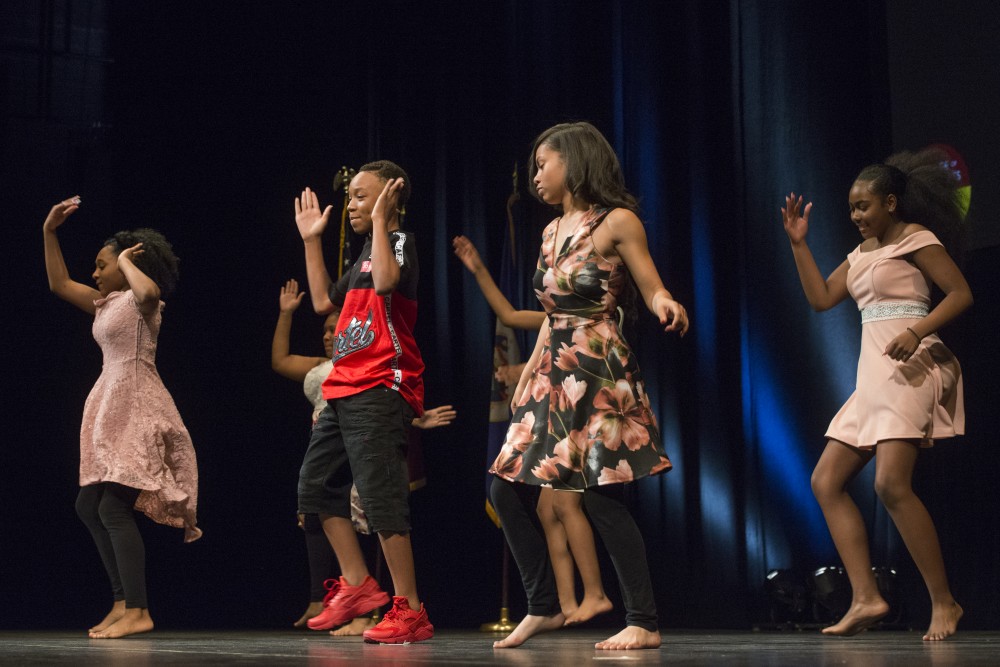 Graduating eighth graders from Northeast Middle School in Minneapolis perform a dance during the ceremony on Thursday, June 7 at Northrup Auditorium. 