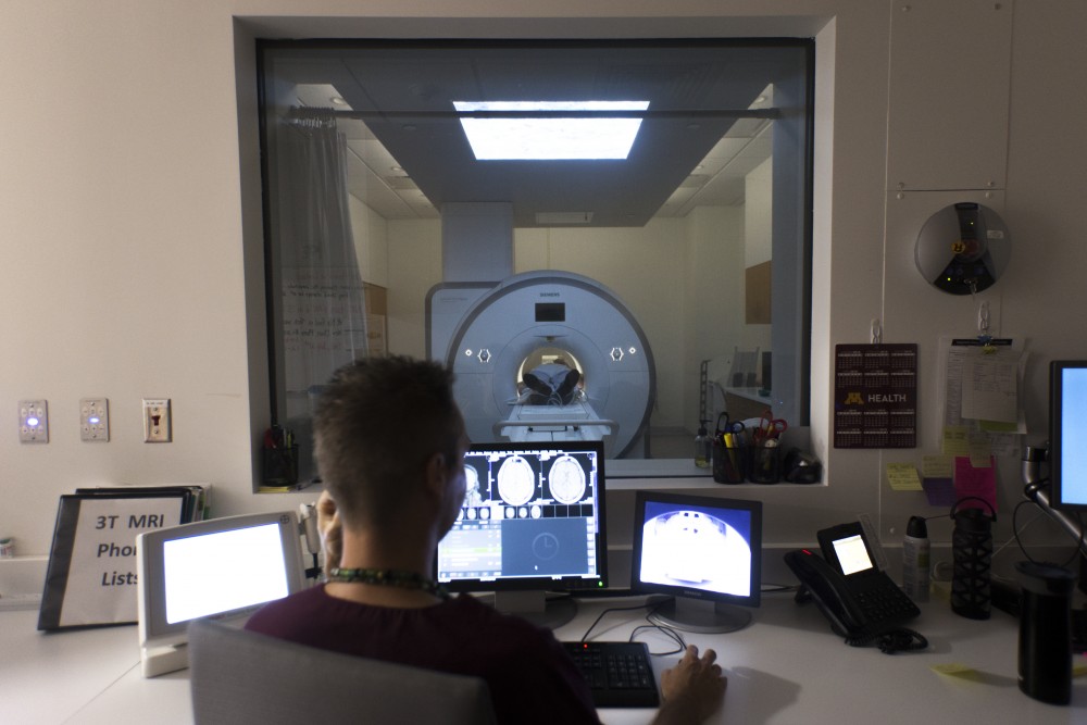 A patient undergoes an MRI of their brain, which stands for magnetic resonance imaging, at the University of Minnesota Health Clinics and Surgery Center on Monday, June 25 in Minneapolis. High demand for MRIs from patients prompted the center to buy a third scanner, which is expected to begin running in December 2018.