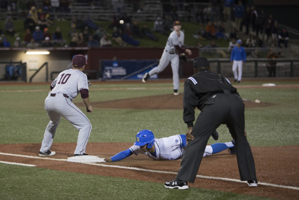 First baseman Cole McDevitt prepares to catch Patrick Fredricksons throw after a UCLA player tried to steal second during the game on Saturday, June 2, 2018 at Siebert Field. The Gophers won 3-2.