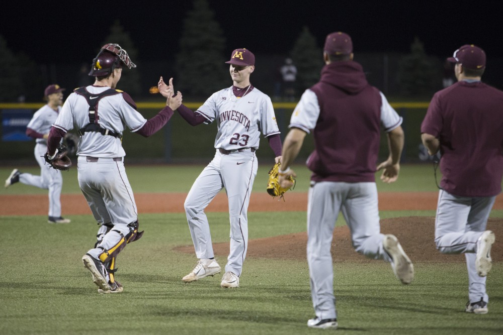 Freshman Max Meyer is congratulated after closing out the win against UCLA on Saturday, June 2, 2018 at Siebert Field. The Gophers won 3-2.