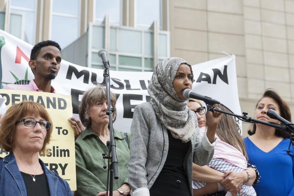 Minnesota state Rep. Ilhan Omar speaks to protestors gathered at the courthouse in downtown Minneapolis on Tuesday, June 26 after the Supreme Court ruled in favor of banning travel into the U.S. from several mostly Muslim countries.