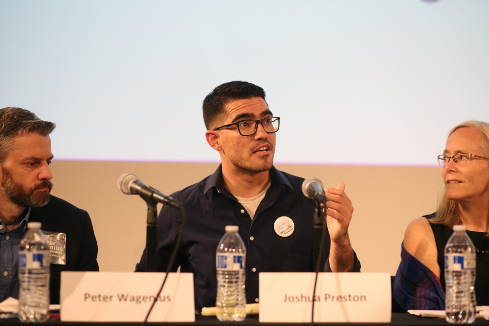University of Minnesota student Joshua Preston speaks at a forum meant to help members of the public learn more about their options for the primaries next month on Monday, July 16 at Cowles Auditorium.