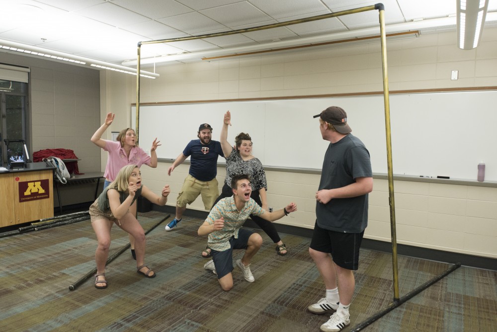 The cast of Wonder and Awe: a Play about Magic, rehearses in Blegen Hall on Monday, July 23. The production will feature futuristic magic, comedy, and puppets and premieres on August 3 for the Minnesota Fringe Festival. 