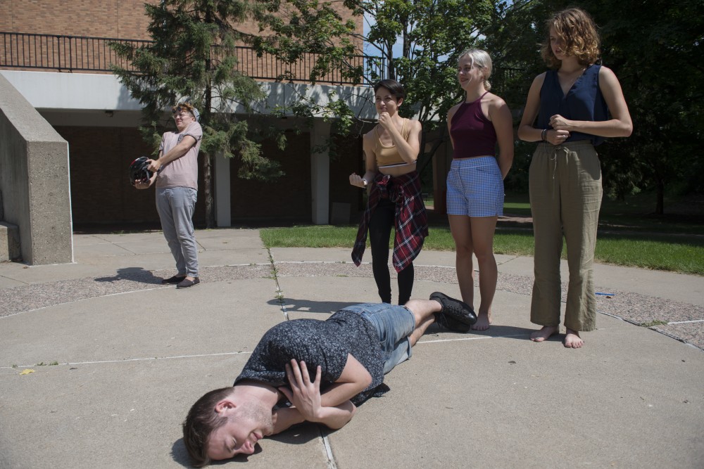 Grand Island Theatre rehearses for their production, Hamlet, but Hamlets a Chicken, on Saturday, July 21 in the amphitheater near Ferguson Hall on West Bank.