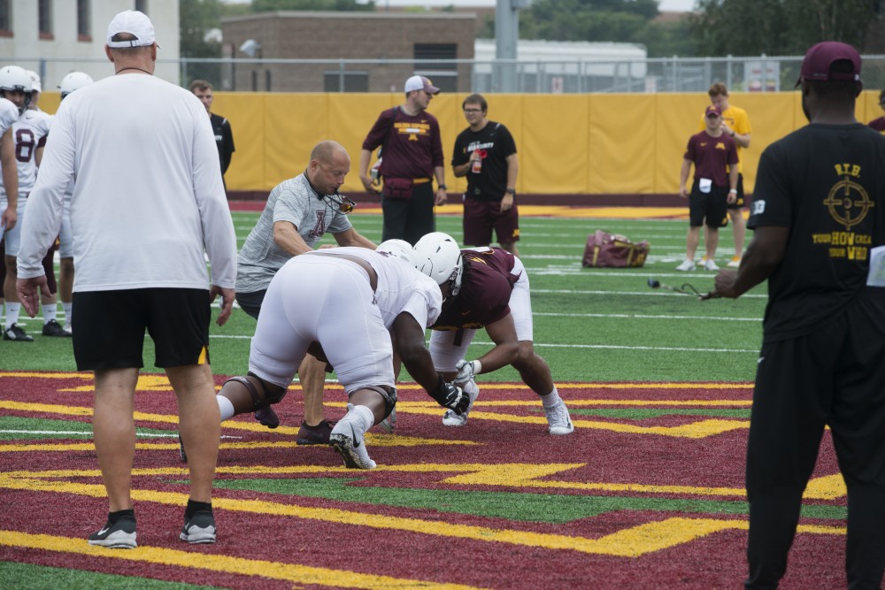 Head Football Coach P.J. Fleck oversees two players going head to head at the Athletes Village practice field on Monday, Aug. 20. 