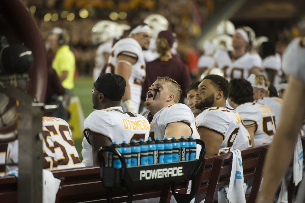 Sideline players react to the big screen at TCF Bank Stadium on Thursday, Aug. 30. The Gophers defeated the New Mexico State Aggies 48-10.