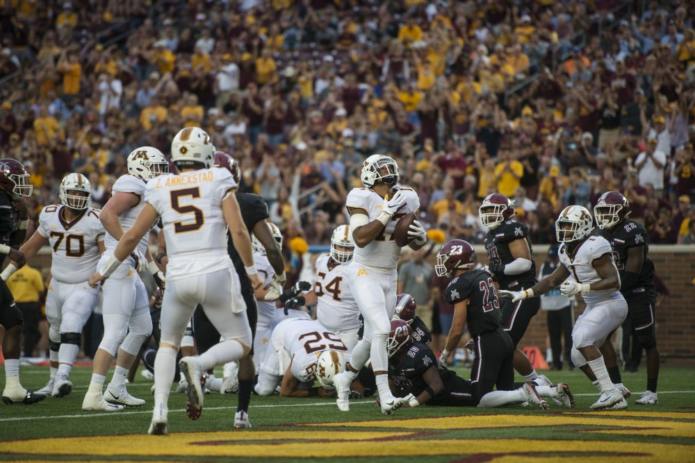 Wide receiver Seth Green scores a touchdown at TCF Bank Stadium on Thursday, Aug. 30. The Gophers defeated the New Mexico State Aggies 48-10.