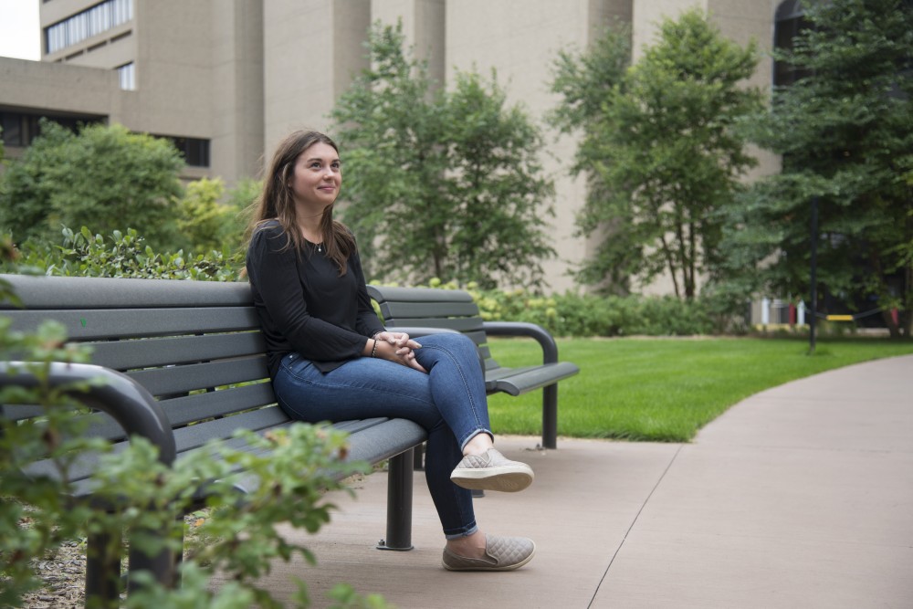 Julie Garvin poses outside of Moos Tower where the majority of her nursing studies are conducted. Garvin developed respiratory symptoms in August, leading her to believe that poor air quality linked to recent wildfires are the cause for her symptoms.