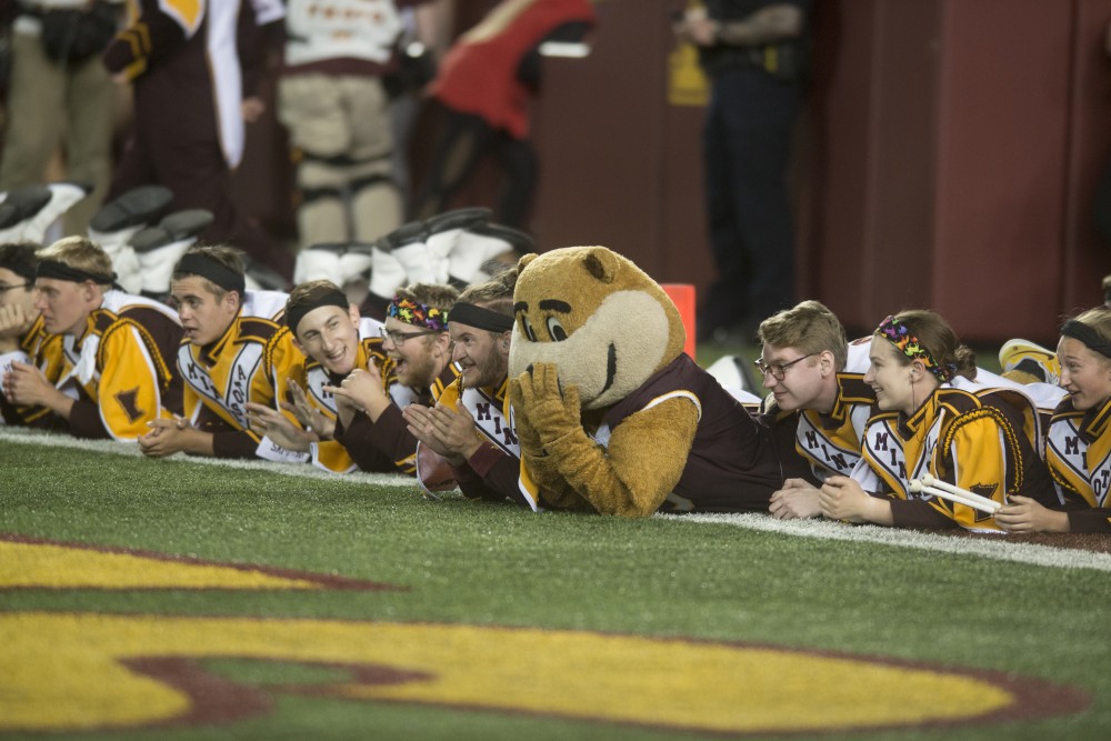 The Gopher Marching Band watches the game against Fresno State from the sidelines at TCF Bank Stadium on Saturday, Sept. 8.