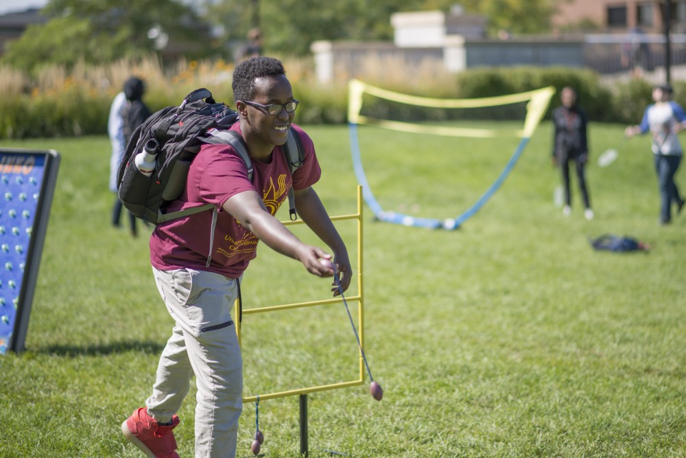 Freshman Khalid Abdalla plays ladder toss at the Eid celebration organized by the Muslim Student Association and the Al-Madinah Cultural Center on Thursday, Sept. 6 in front of Coffman Memorial Union. 