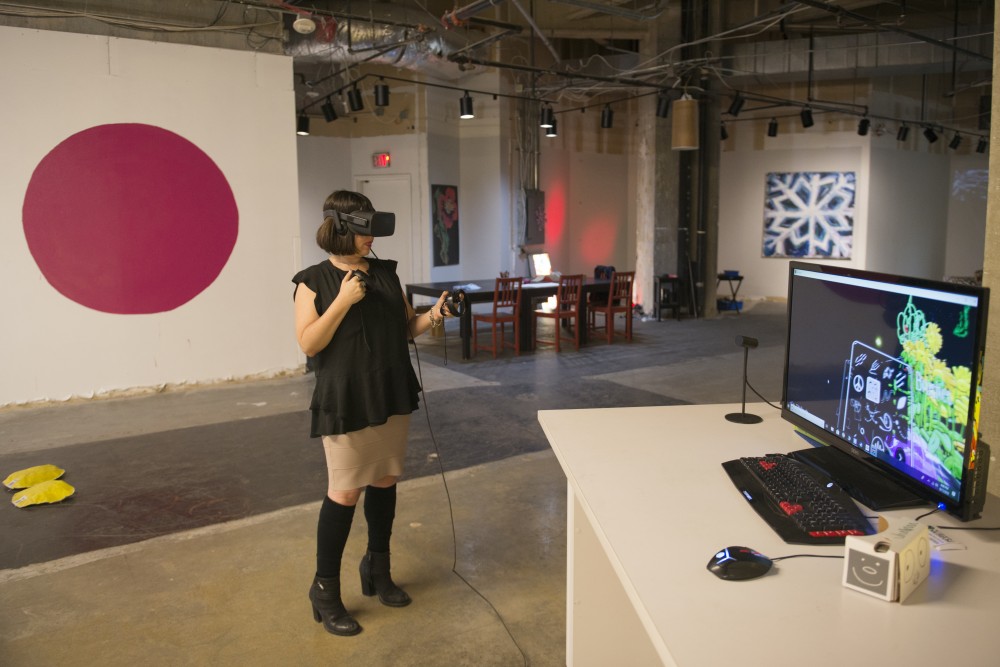Paige Dansinger, the founding director of Better World Museum in downtown Minneapolis, draws on Tilt Brush, a program on the Oculus Rift in the virtual reality studio on Tuesday, Sept. 11. The Better World Museum is open to the public, where viewers can use the virtual reality studio, a collaborative space that Dansinger says people from all over the world have used. 