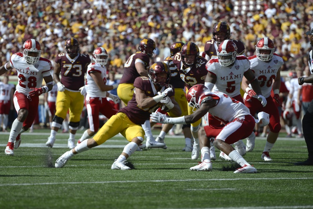 Freshman Bryce Williams works to keep the ball away from Miami University on Saturday, Sept. 15 at TCF Bank Stadium in Minneapolis.