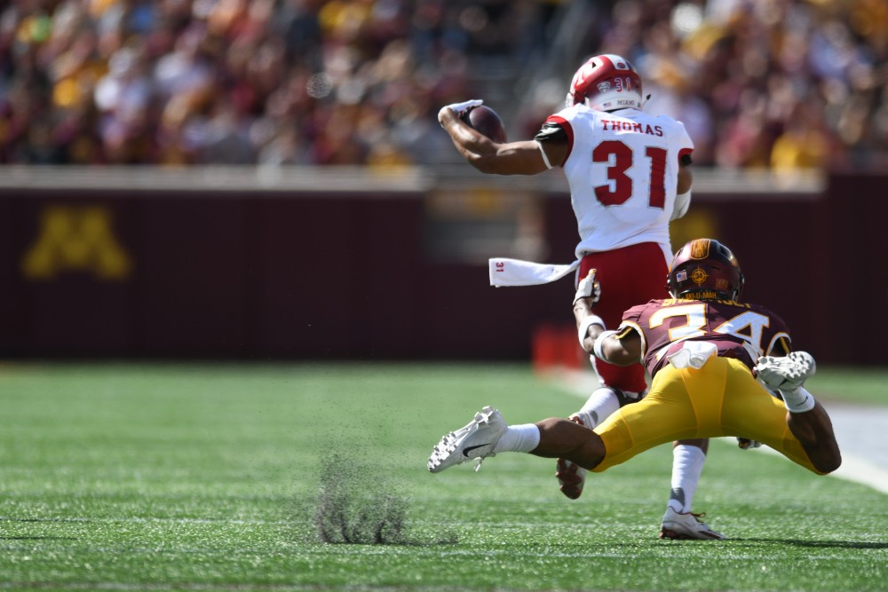 Senior Antonio Shenault attempts to tackle a Miami University player on Saturday, Sept. 15 at TCF Bank Stadium in Minneapolis.