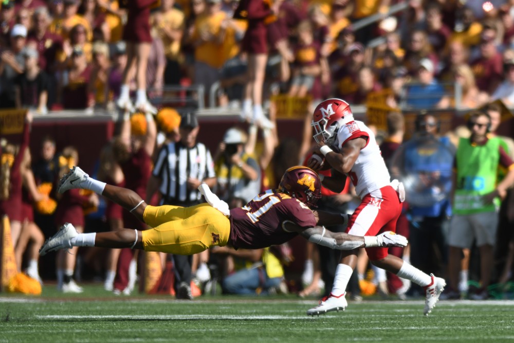 Bryce Williams attempts to tackle a Miami University player on Saturday, Sept. 15 at TCF Bank Stadium in Minneapolis.