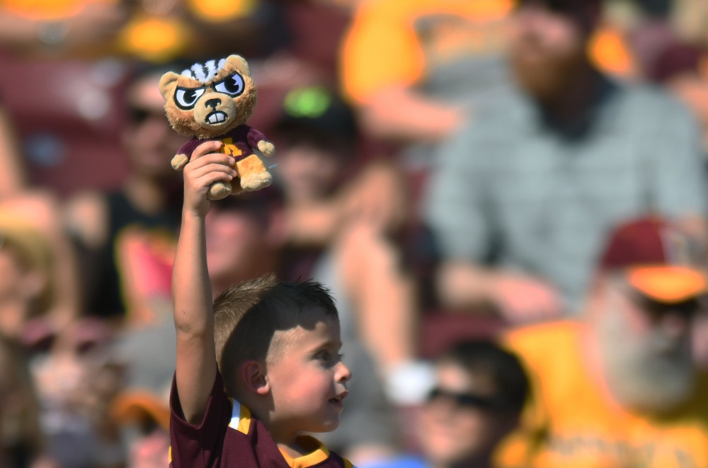 A gopher football fan holds up a mascot toy on Saturday, Sept. 15 at TCF Bank Stadium in Minneapolis.