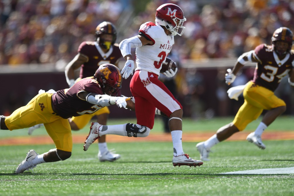 Miami holds the ball during the game on Saturday, Sept. 15 at TCF Bank Stadium in Minneapolis.