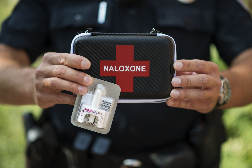 UMPD Officer Josh Betts holds a narcan nasal spray kit on Friday, Sept. 14, 2018 in Minneapolis. The kit can be used for emergency treatment of opioid overdose. 