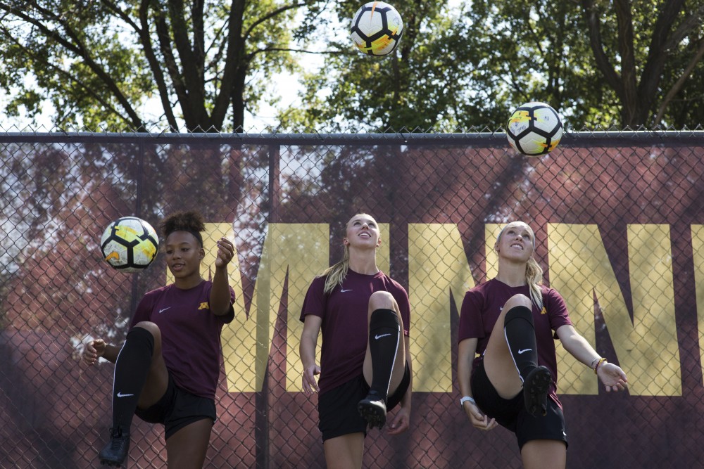 Freshman forwards Patricia Ward, left, McKenna Buisman and Megan Gray knee the ball for a portrait on Wednesday, Sept. 12 at Elizabeth Lyle Robbie Stadium in Saint Paul. The three freshman have played in all seven matches so far this season.