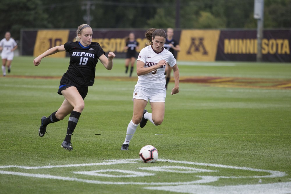 Freshman Delaney Stekr pushes to beat her opponent to the ball during the game against DePaul on Thursday, Aug. 30 at Elizabeth Lyle Robbie Stadium.