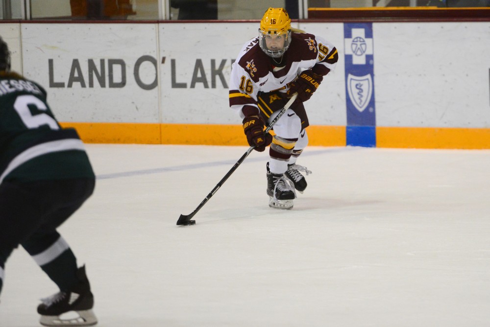 Redshirt freshman forward Amy Potomak skates with the puck on Friday, Sept. 28, 2018 at Ridder Arena. 