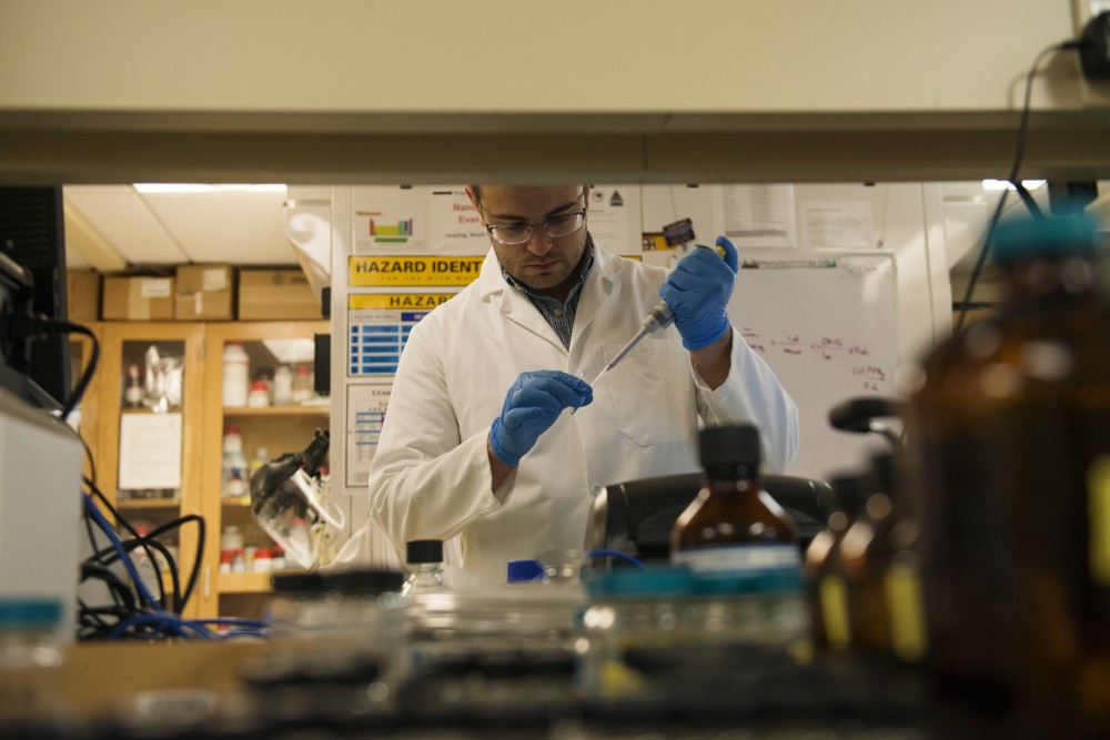 Graduate research assistant John Brockgreitens, who is working on a test that finds bacteria in food, works in a lab on the Saint Paul Campus on Tuesday, October 2. The research was created in response to recent food borne illness outbreaks in the United States.