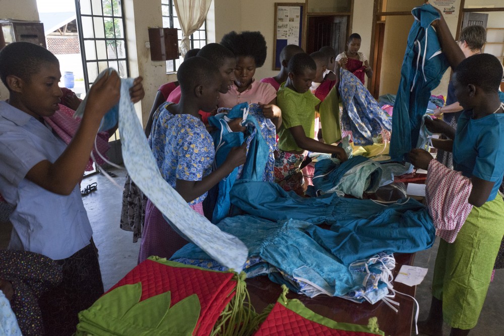 Blue House, a girls orphanage in rural Uganda, partnered with an apparel design course at the University to create clothing items for the girls in need.