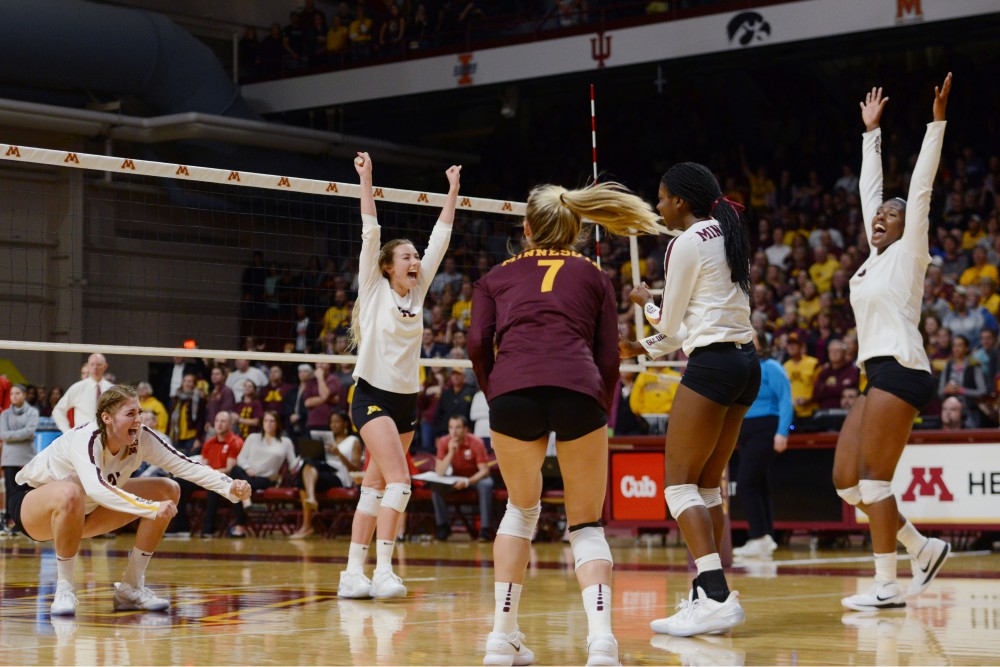 The Gophers celebrate victory on Tuesday, Sept. 26 at Maturi Pavillon. 