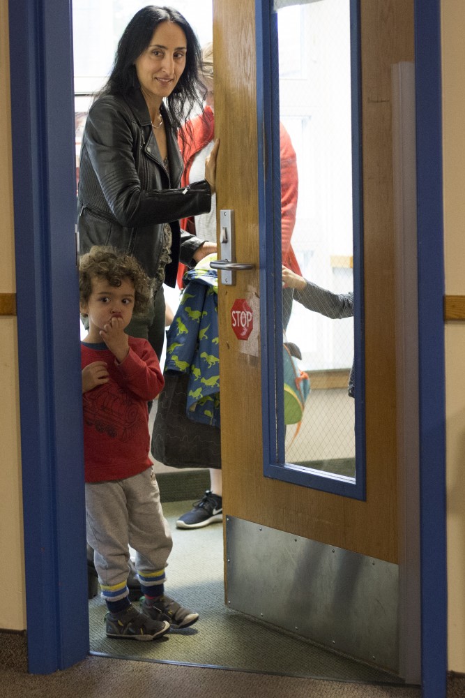 Associate Professor of Veterinary Clinical Sciences Antonella Borgatti drops off her sons Leonardo and Lorenzo Everest at the University of Minnesota Child Development Center on Wednesday, Oct. 3 in Minneapolis. She drops her boys off every morning before going to work on campus.