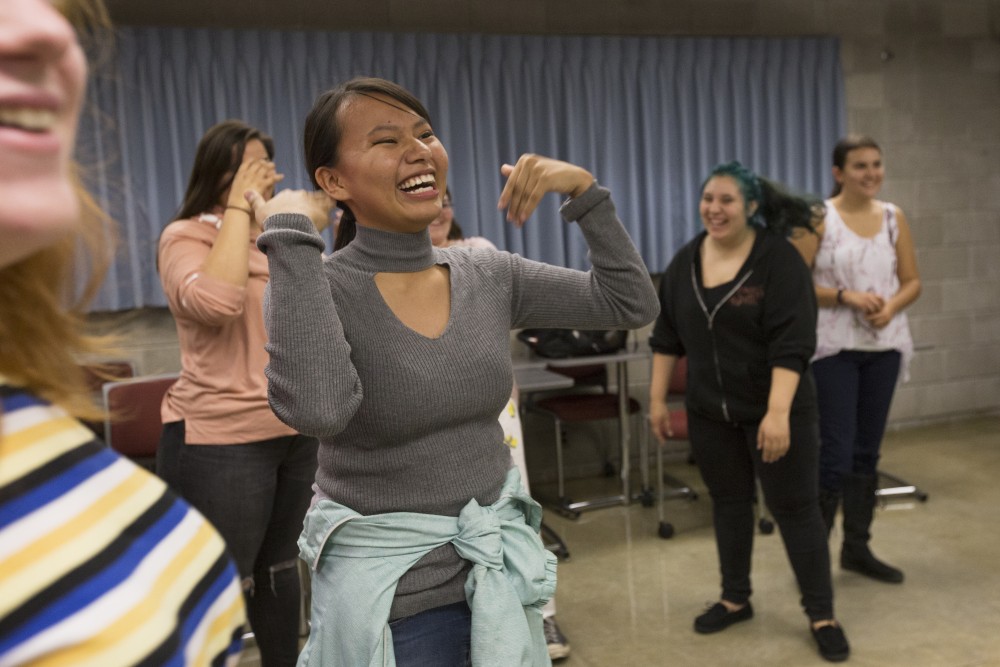 Native American Studies student Claudia Iron Hawk fans herself during her traditional Native American dance class on Wednesday, Oct. 3 at the University of Minnesota-Morris campus. 