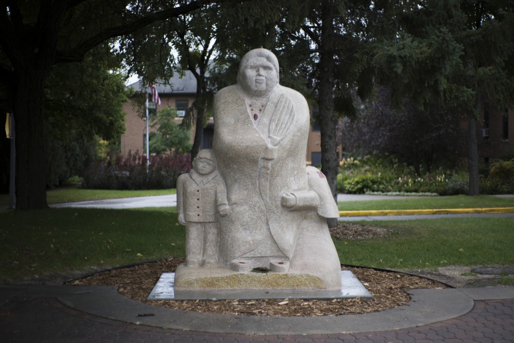 The Goodwin Statue sits across from the Multi-Ethnic Resource Center on Wednesday, Oct. 3 at the University of Minnesota-Morris campus. Duane Goodwin carved the traditional Anishinaabe stone statue.