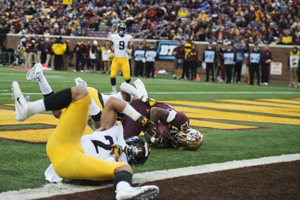Wide receiver Rashod Bateman scores a touchdown on Saturday, Oct. 6 at TCF Bank Stadium. The Hawkeyes defeated the Gophers 48-31. 