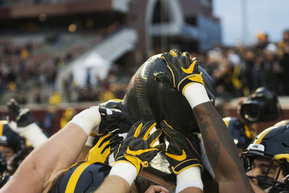 21Floyd of Rosedale is hoisted into the air on Saturday, Oct. 6 at TCF Bank Stadium. The Hawkeyes defeated the Gophers 48-31. 