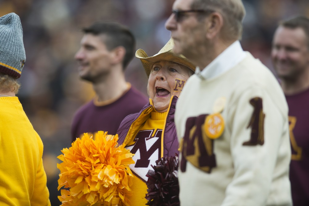 Alumni cheer on Saturday, Oct. 6 at TCF Bank Stadium. The Hawkeyes defeated the Gophers 48-31. 