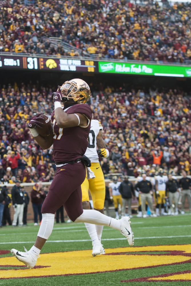 Seth Green celebrates in the end zone after scoring a touchdown on Saturday, Oct. 6 at TCF Bank Stadium. The Hawkeyes defeated the Gophers 48-31. 